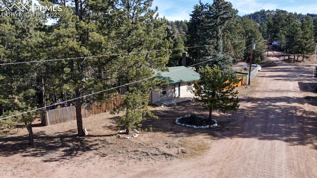 Image 10 of 43: Surrounding community featuring a forest view