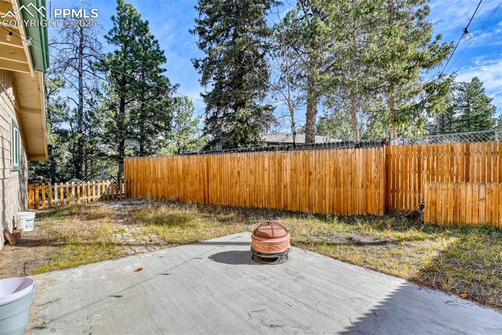 Image 16 of 42: Fenced backyard featuring a patio area