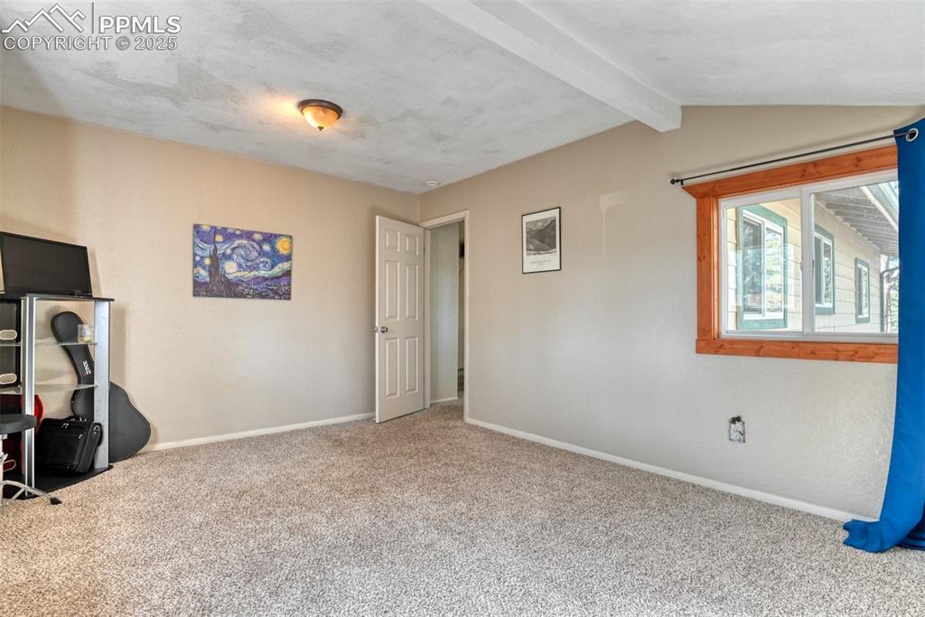 Image 40 of 43: Unfurnished bedroom featuring baseboards and carpet
