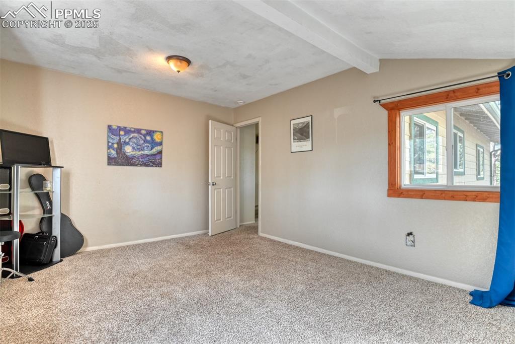 Image 41 of 42: Unfurnished bedroom featuring baseboards and carpet