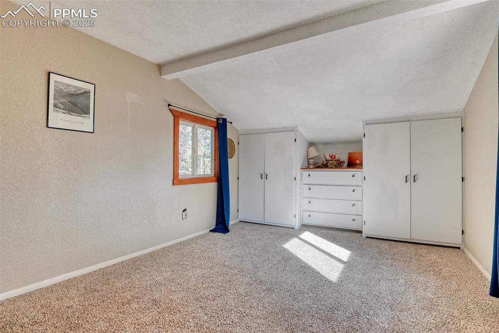 Image 41 of 43: Unfurnished bedroom with multiple closets and light carpet
