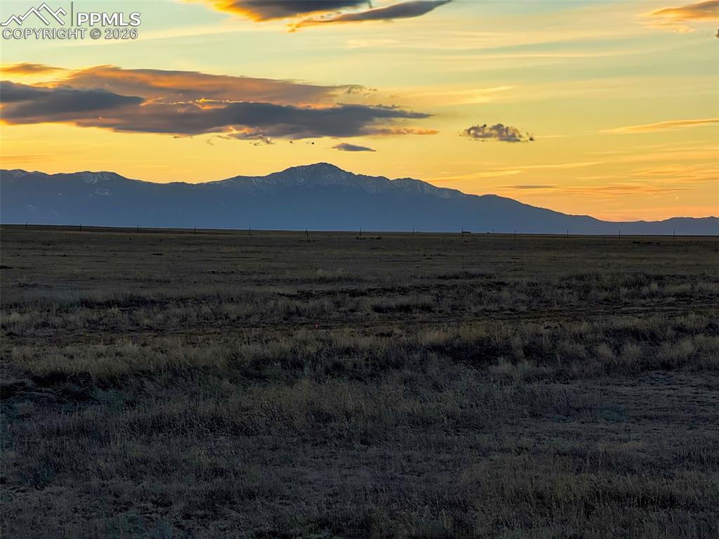 Image 11 of 12: Sunset View – Mountain Silhouette – Striking sunset view with the mountain 