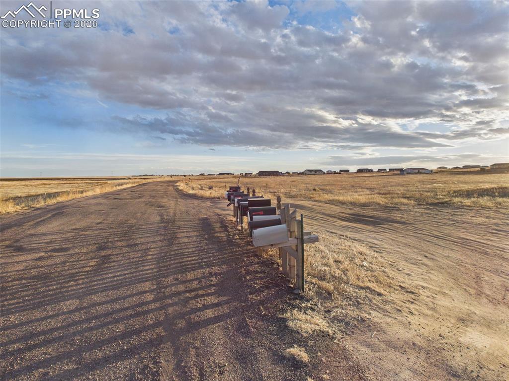 Image 12 of 12: Community Access – Road & Mailboxes – View of the maintained roadway and ne