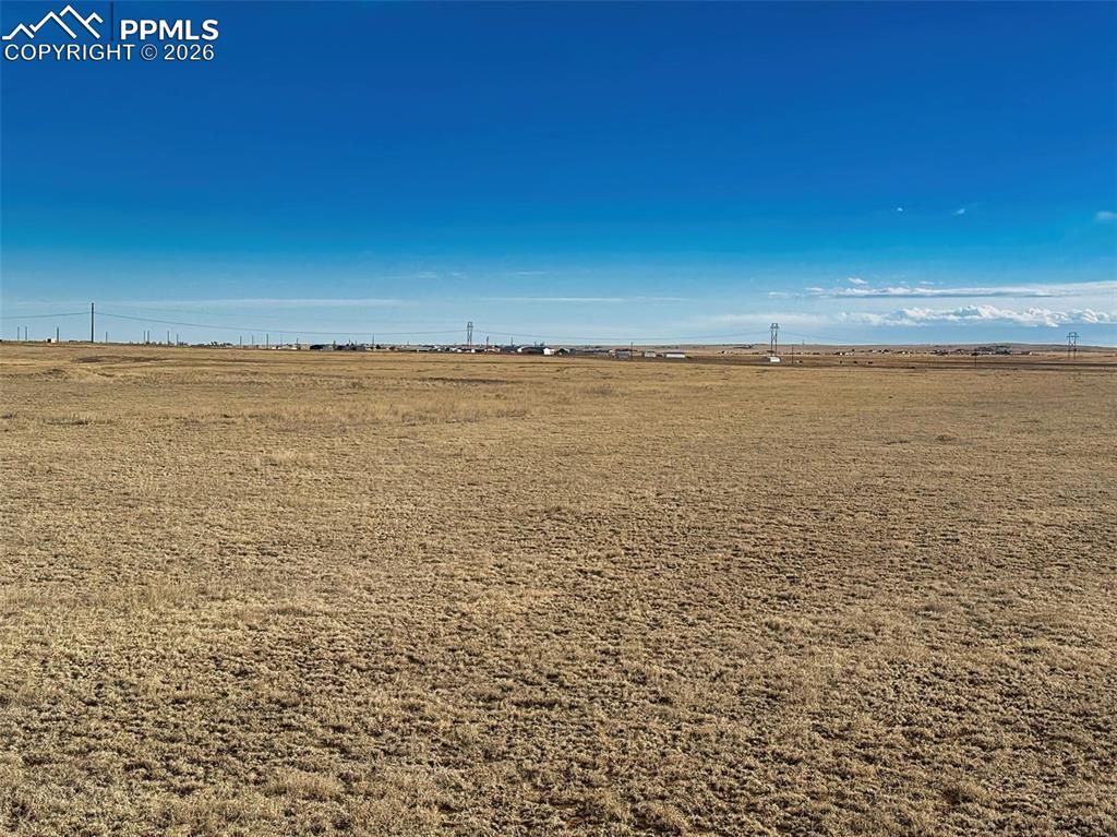 Image 2 of 12: Lot View – Utility Proximity – View across the parcel with nearby utility i