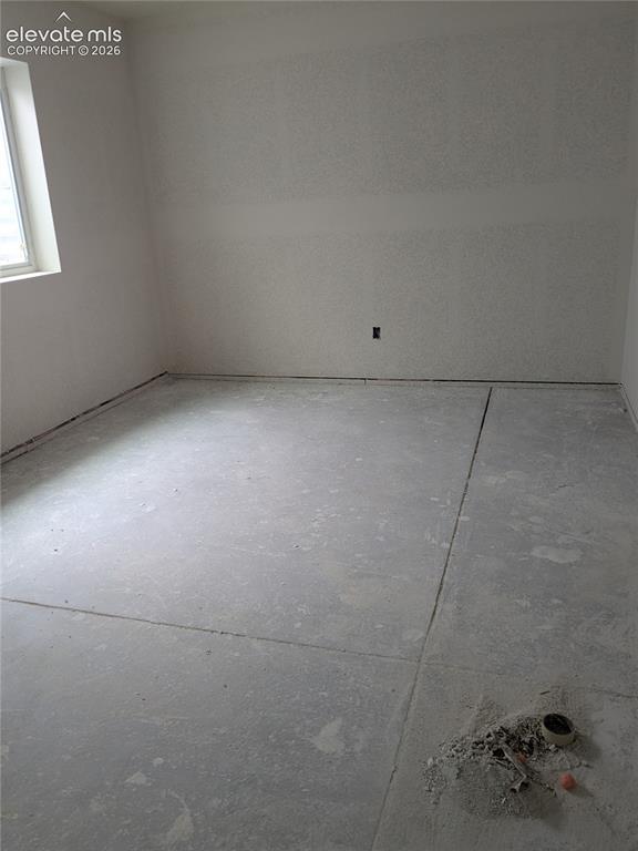 Image 28 of 45: walls, a white-framed window, and a concrete floor