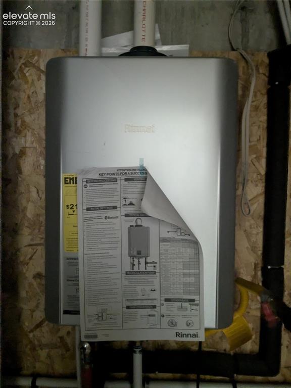 Image 39 of 45: Tankless water heater installed on an OSB wall