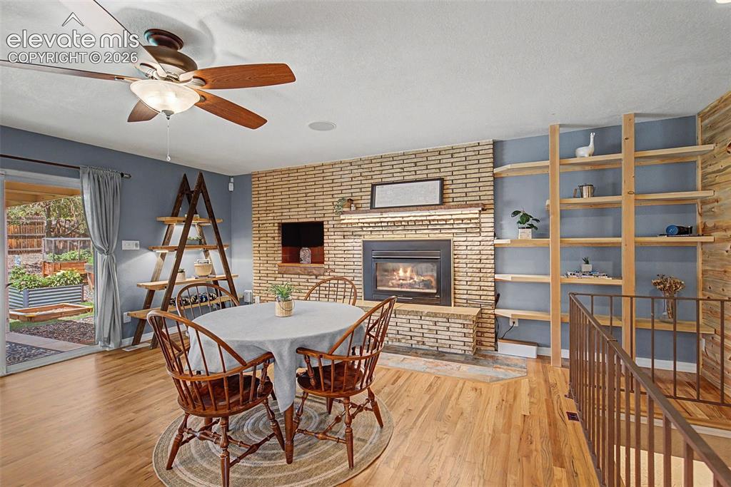 Image 12 of 34: Main level family room currently used for dining.