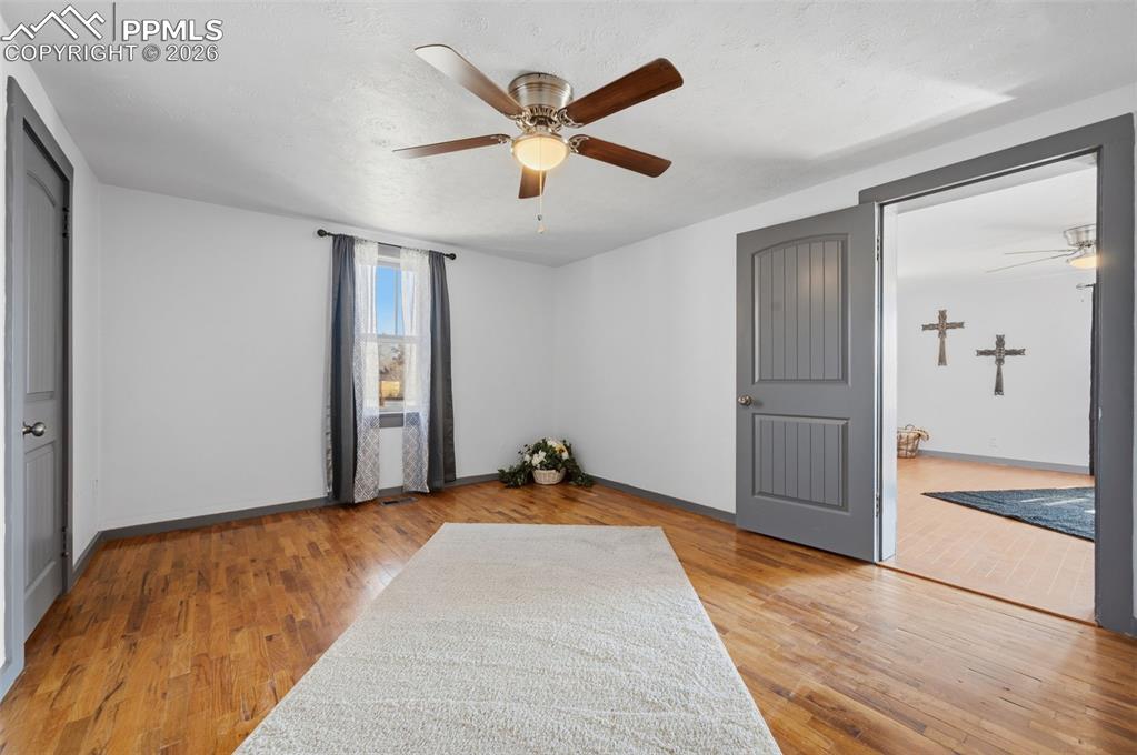 Image 19 of 50: The primary bedroom is close to the living room and is aprx 15