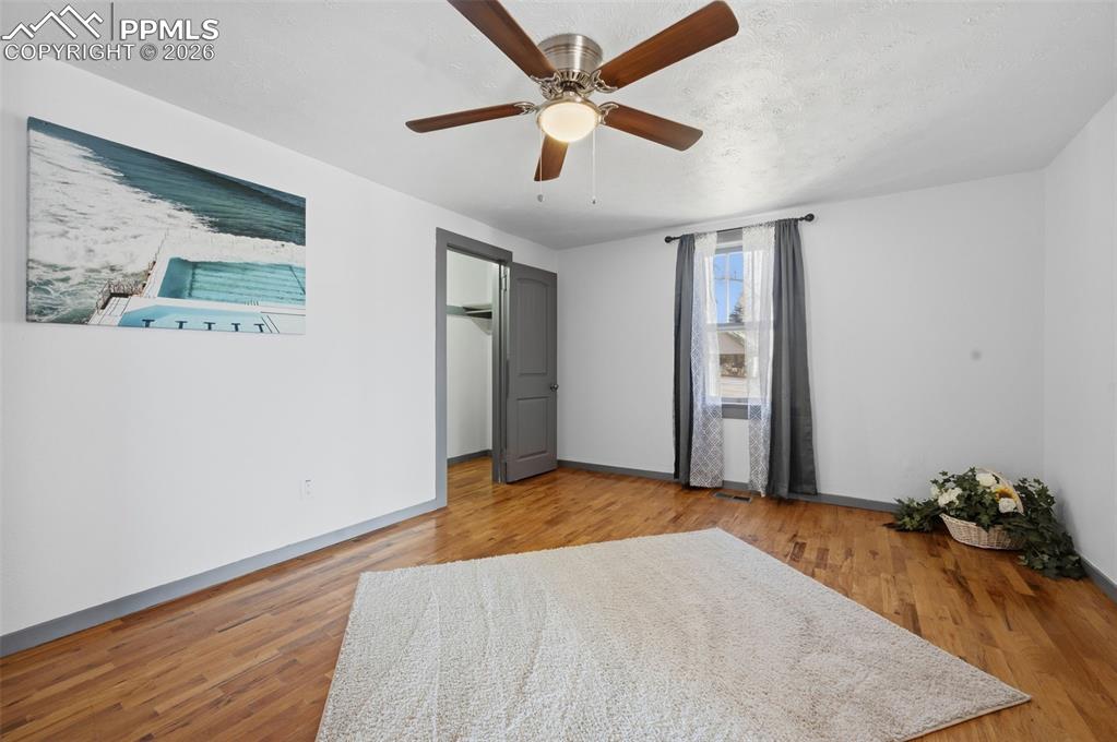 Image 20 of 50: This primary bedroom has a walkin closet with a westerly facing windot look