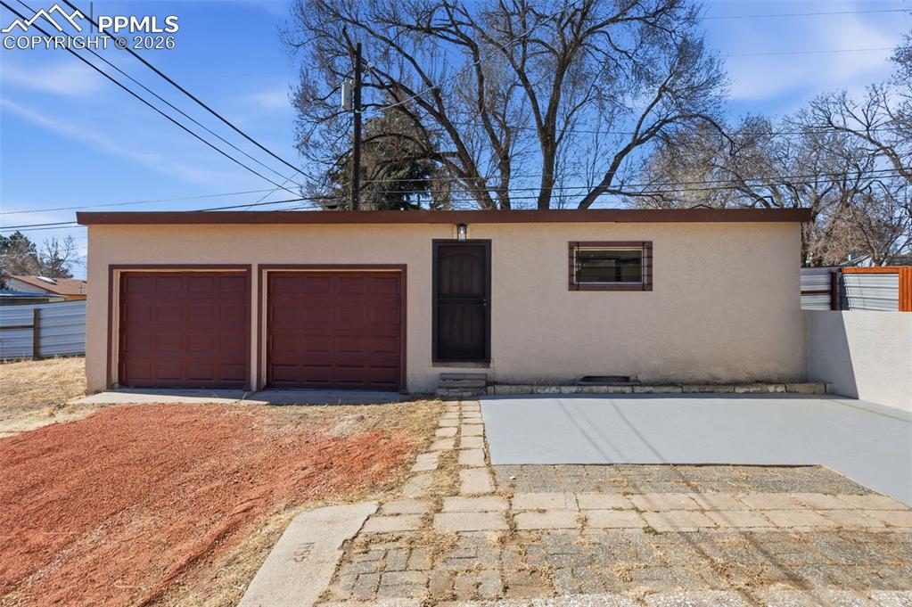 Image 33 of 50: Picture of the 2 car garage, with automatic openers and remotes AND the Gue