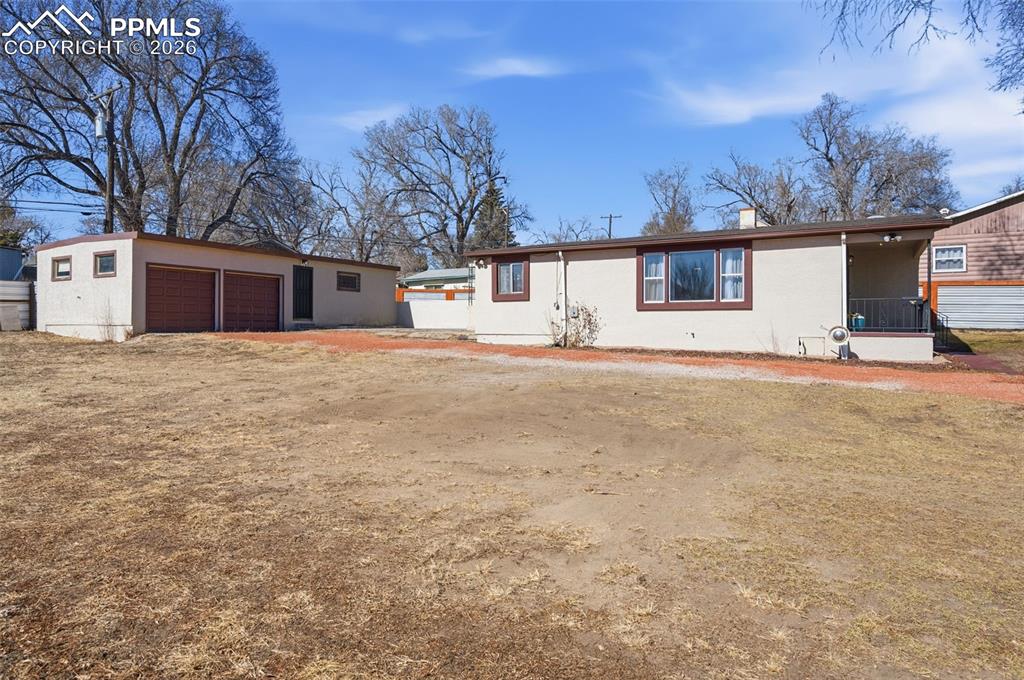 Image 44 of 50: This is the south side of the house, garage and ADU.