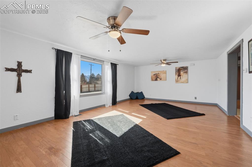 Image 8 of 50: This grand living room can easily be divided into an additional bedroom.