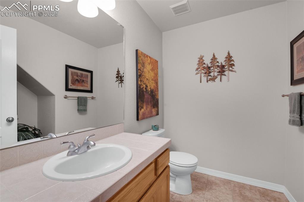 Image 18 of 50: Main Level Powder Room
