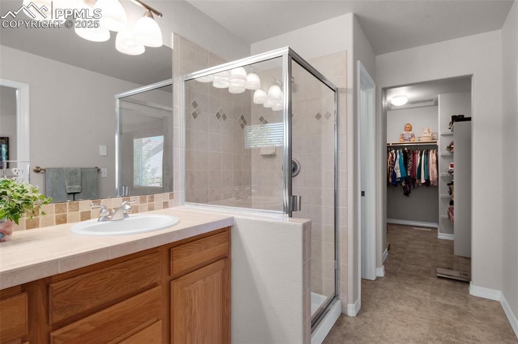 Image 24 of 50: NEW Heated Flooring Flows Through Bath To Closet