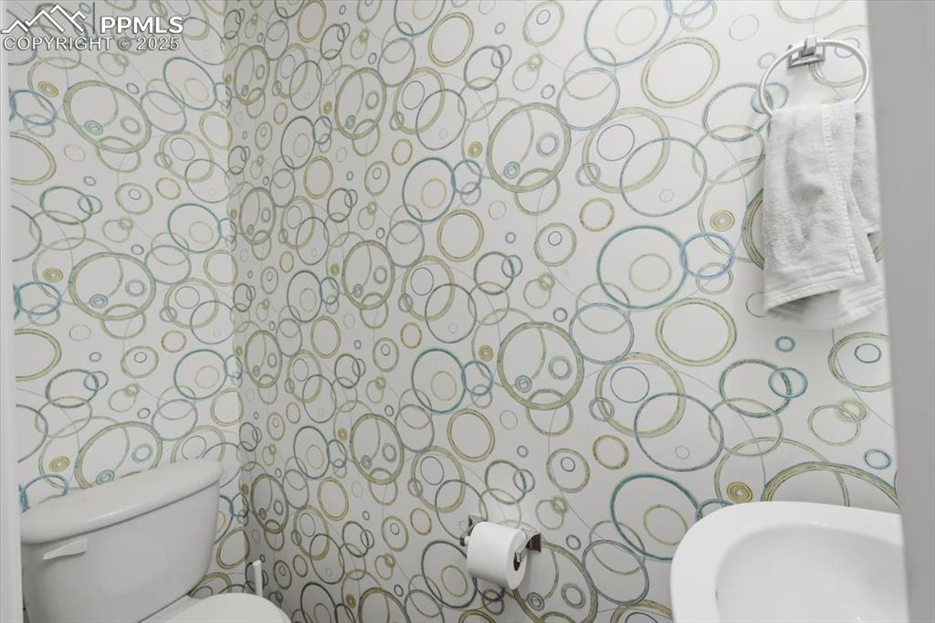 Image 13 of 32: Main level guest bathroom.