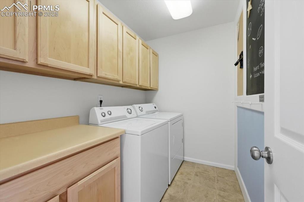 Image 17 of 32: Upper level laundry room. Washer and dryer included.