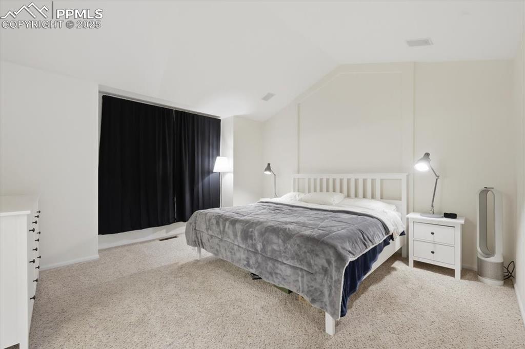 Image 18 of 32: Upper level primary suite.