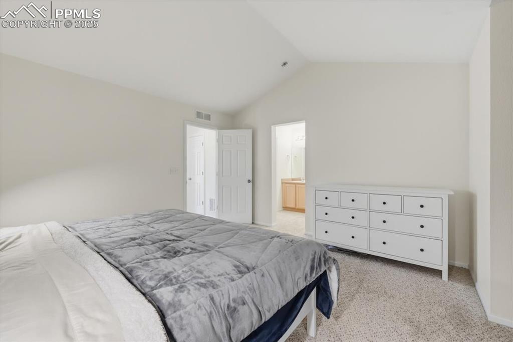 Image 21 of 32: Primary suite with attached bathroom.