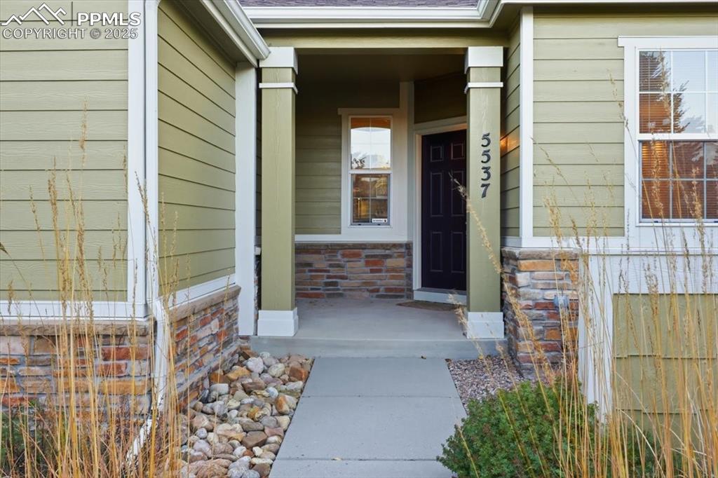 Image 26 of 32: Covered front entry.