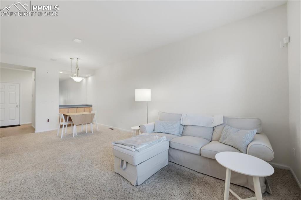 Image 7 of 32: Living room and dining area.