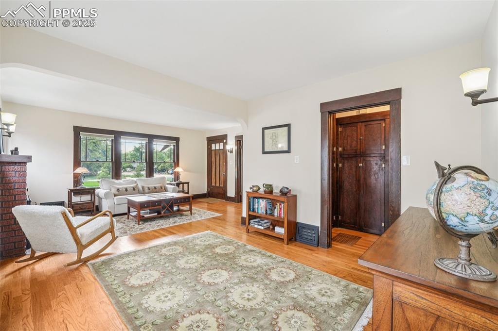 Image 12 of 49: Living area featuring light wood-style floors