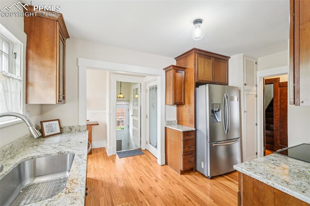 Image 16 of 49: Kitchen(newly renovated) featuring stainless steel appliances, light wood-s