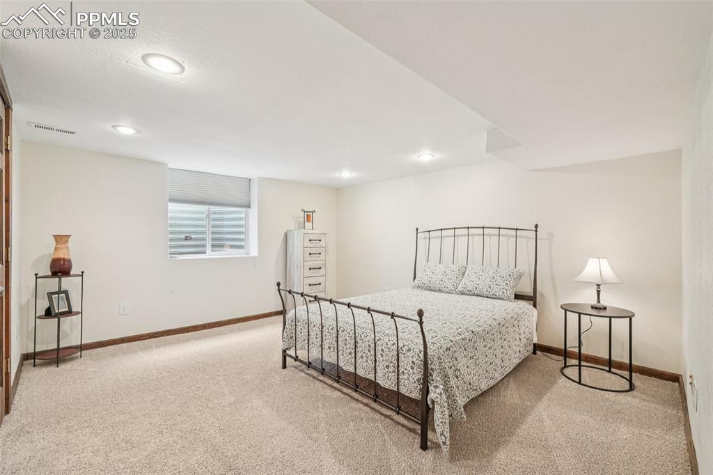 Image 35 of 49: Carpeted bedroom featuring baseboards and recessed lighting