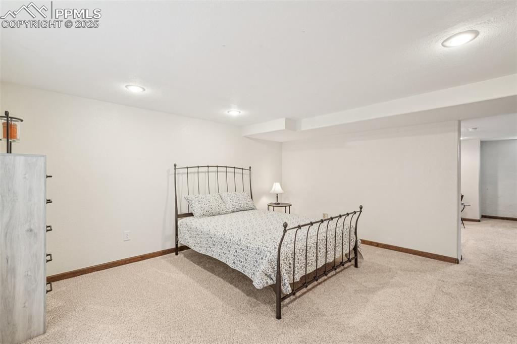 Image 36 of 49: Carpeted bedroom featuring recessed lighting