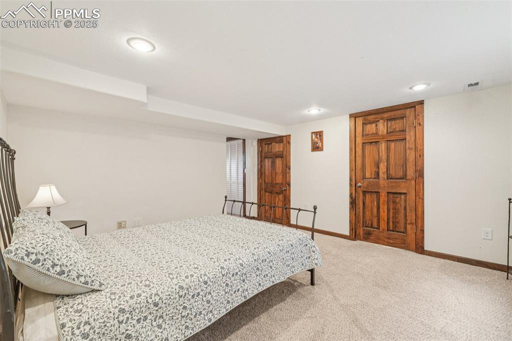 Image 37 of 49: Carpeted bedroom featuring baseboards and recessed lighting