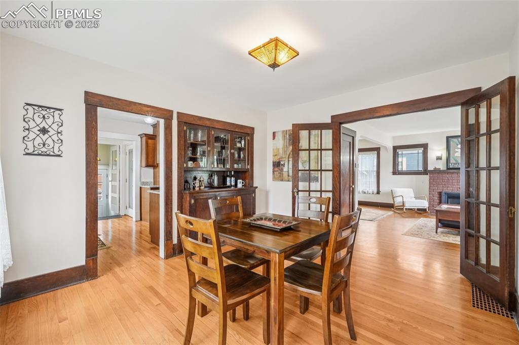 Image 4 of 49: Dining space with light wood-style floors
