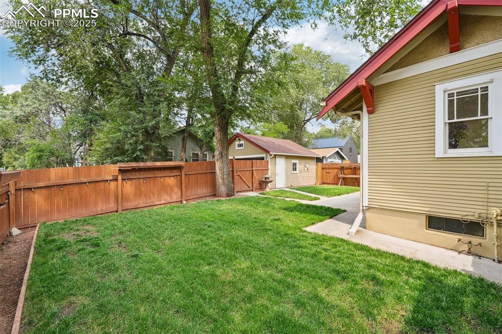 Image 41 of 49: View of fenced backyard