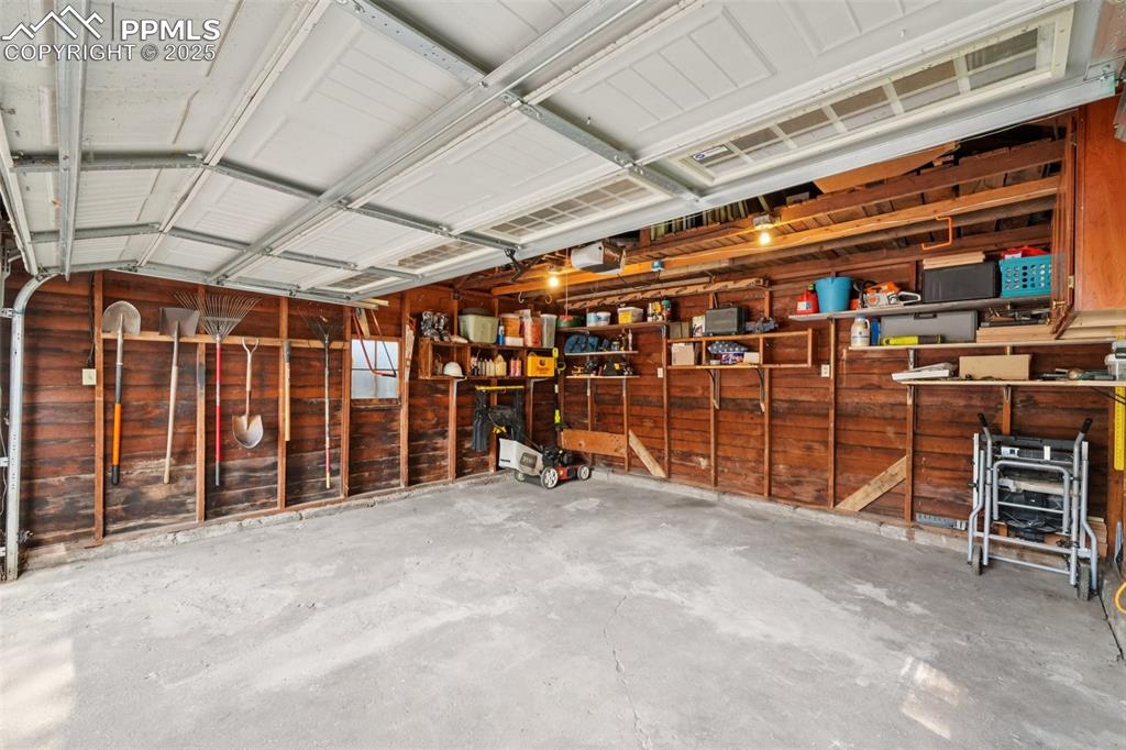 Image 44 of 49: Garage with a garage door opener