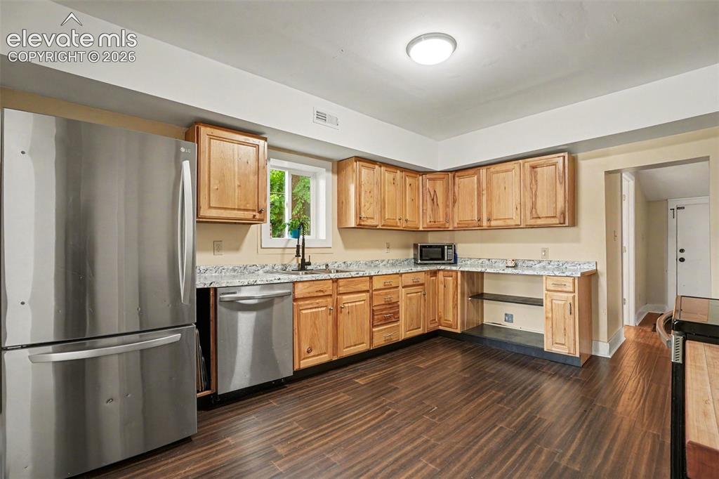 Image 11 of 23: Brand new carpentry, new countertops, and stainless steel appliances.