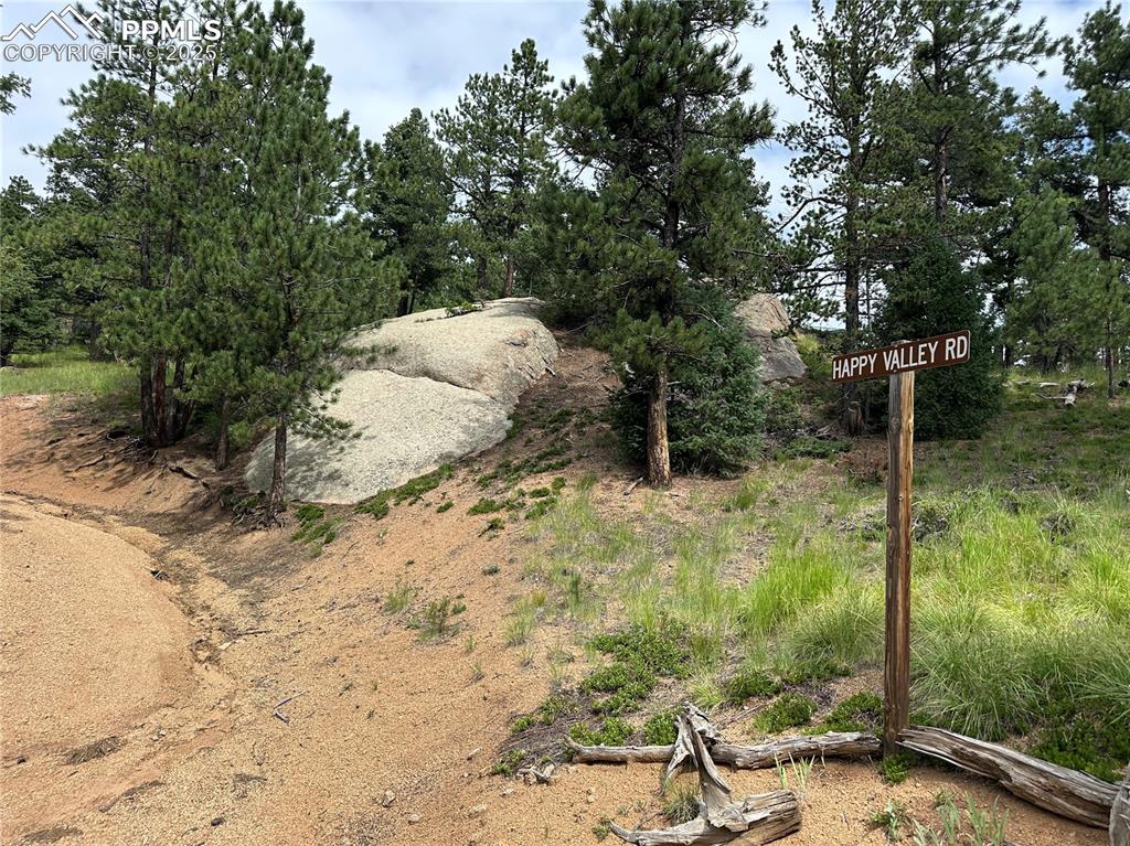 Image 18 of 25: The entrance to happy valley road with rock outcroppings