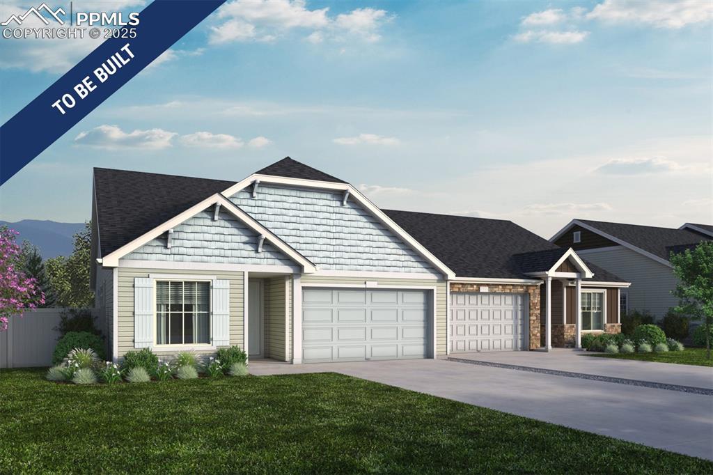 Caption: View of front facade featuring a garage, a front lawn, fence, and driveway