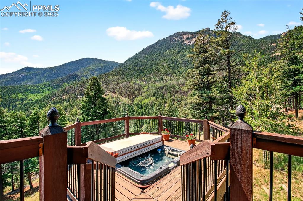 Image 20 of 50: Deck off primary bedroom with hot tub!