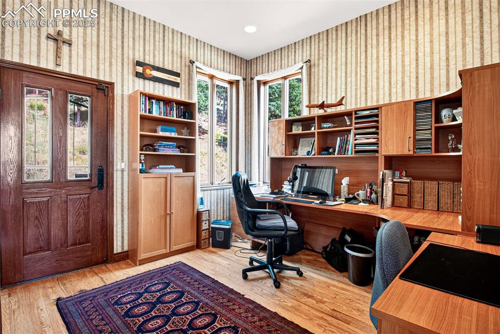 Image 29 of 50: Office of the dining area with walk out to backyard