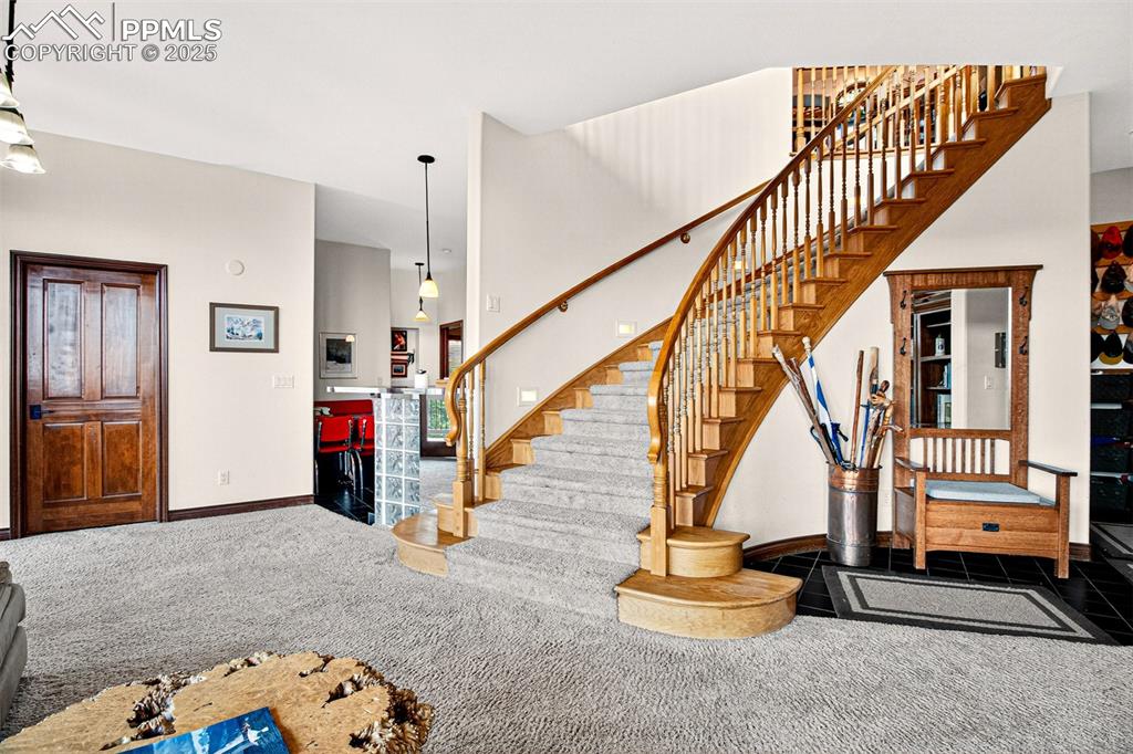 Image 31 of 50: Recreation room on lower level with wood burning fireplace and a  walk out 