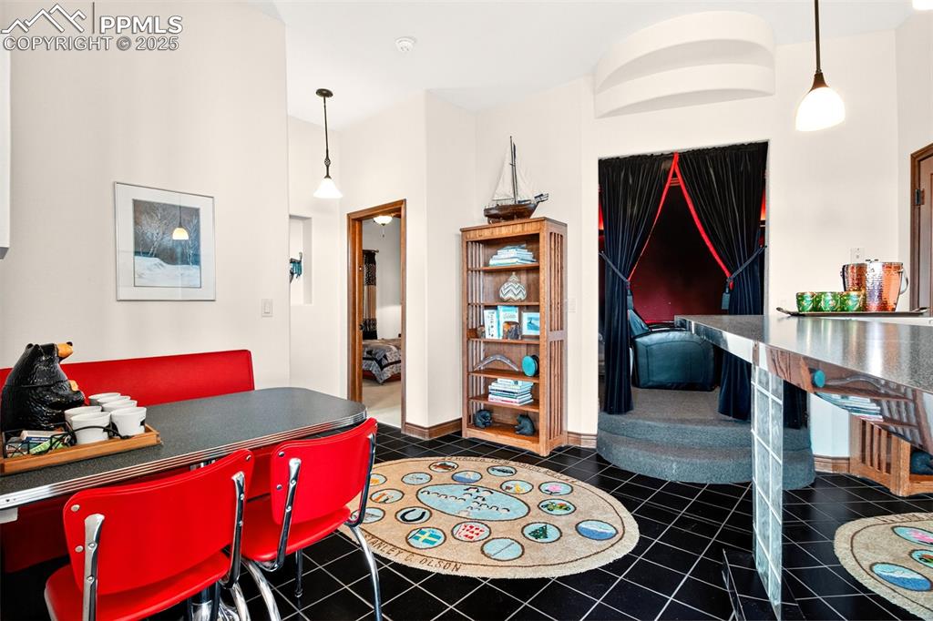 Image 37 of 50: Wet bar going into the media room and bedroom 2 and 3