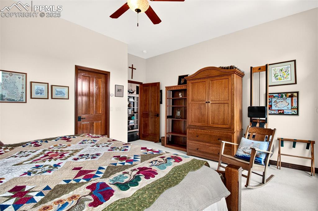 Image 40 of 50: Bedroom 2 on lower level with gas burning fireplace, walk out to back deck 
