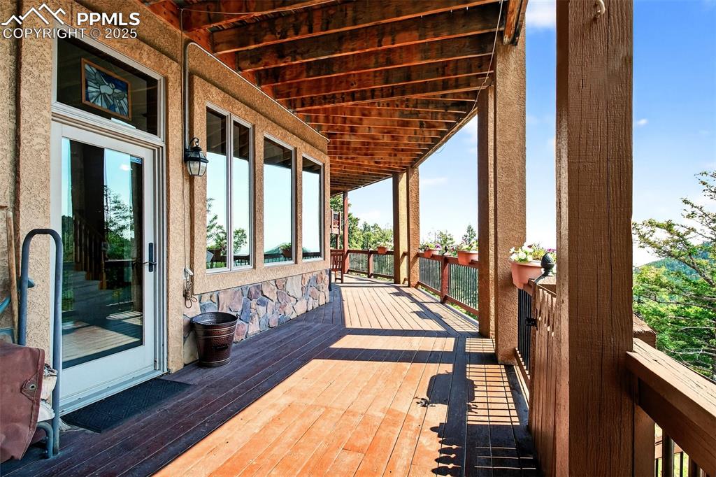 Image 41 of 50: Covered deck off bedroom 2