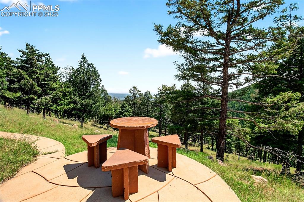 Image 48 of 50: Front yard patio with views that