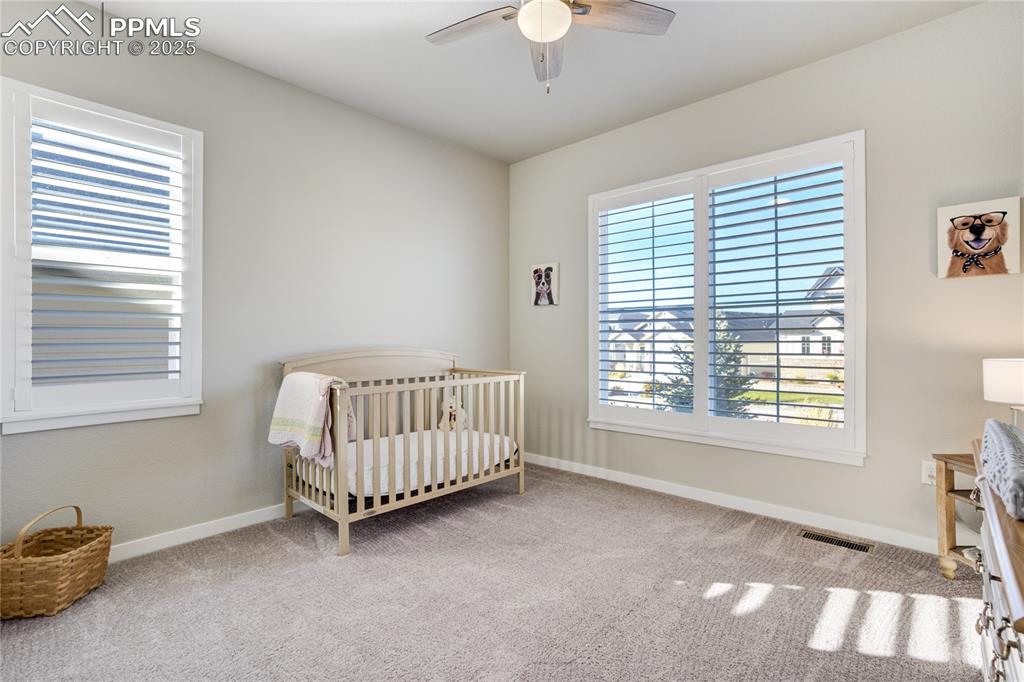 Image 25 of 50: Perfect for guests or a home office, with a nearby full bath for added conv