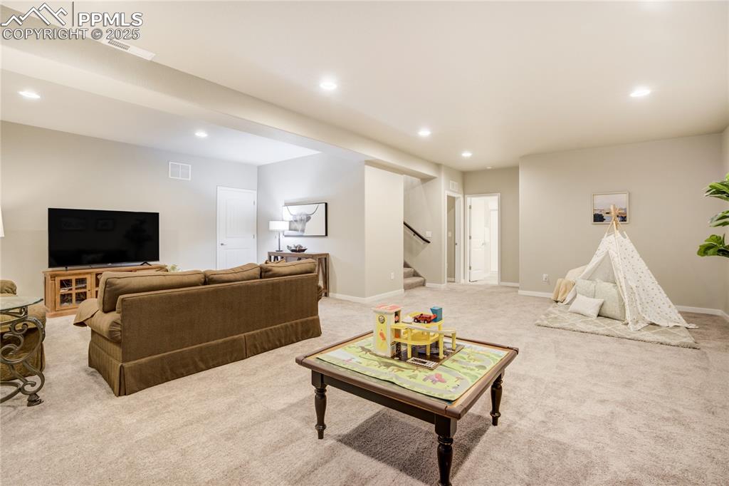 Image 29 of 50: Expansive recreation space with 9-foot ceilings—ideal for entertainment, pl