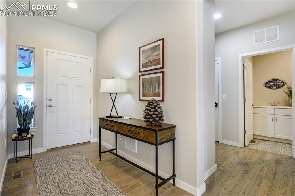 Image 3 of 50: A light-filled entry sets the tone for connection, comfort, and effortless 