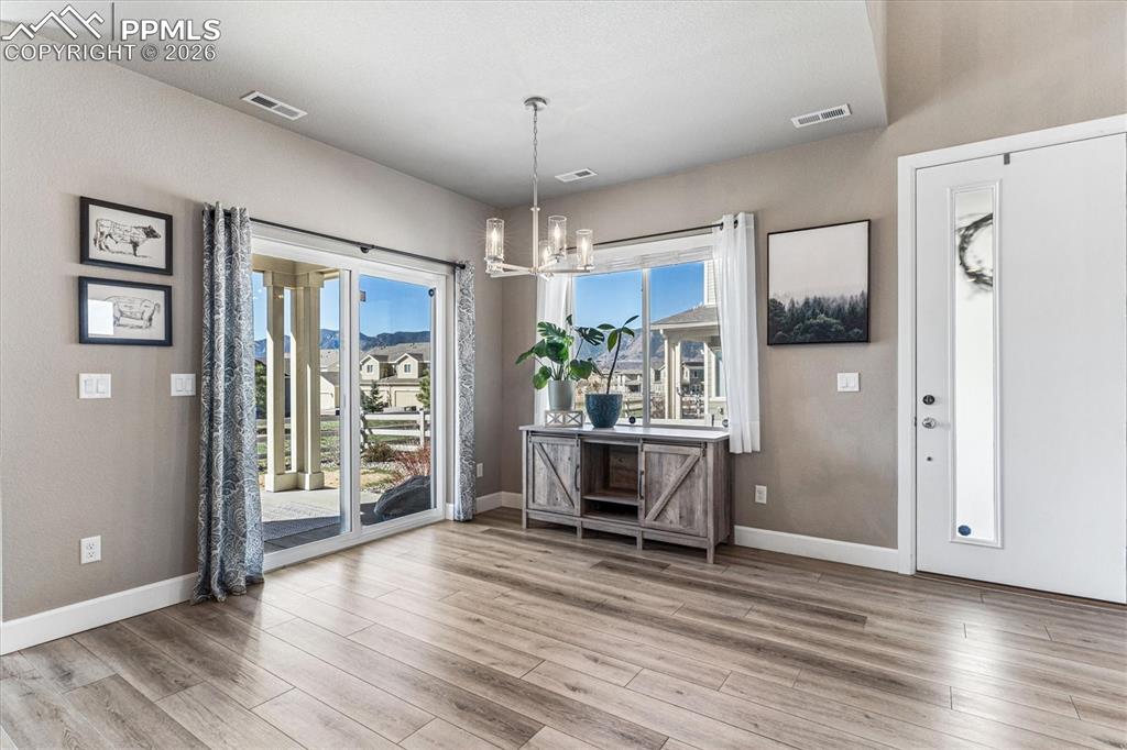 Image 12 of 31: Covered Patio with mountain views off the Dining area