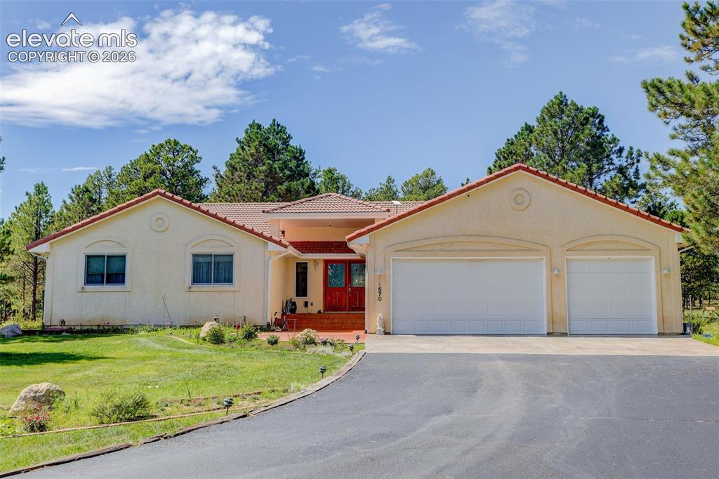 Image 1 of 49: Front of property with garden area.