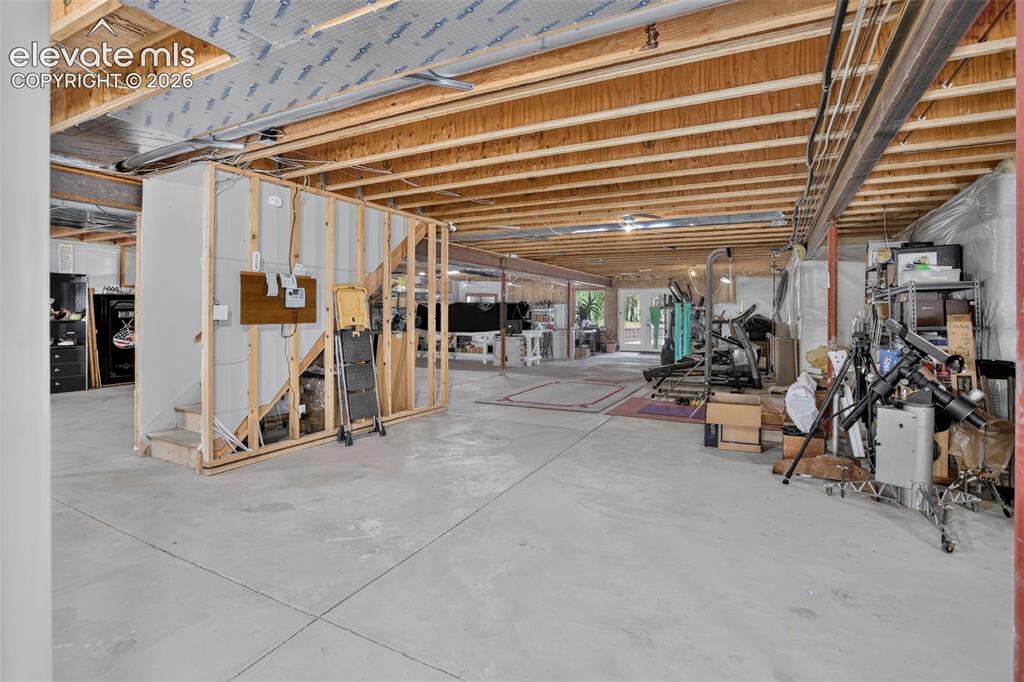 Image 36 of 49: Unfinished basement.