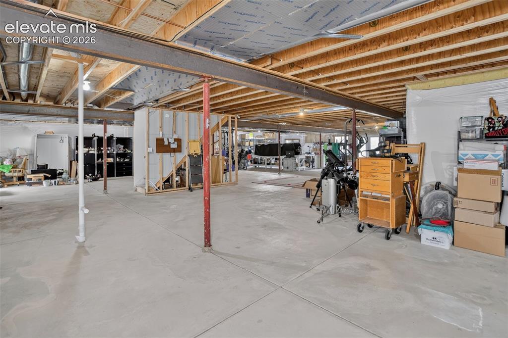 Image 37 of 49: Unfinished basement. 