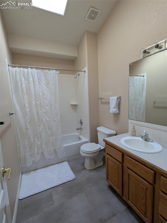 Image 13 of 33: Bathroom with vanity and shower / bathtub combination with curtain